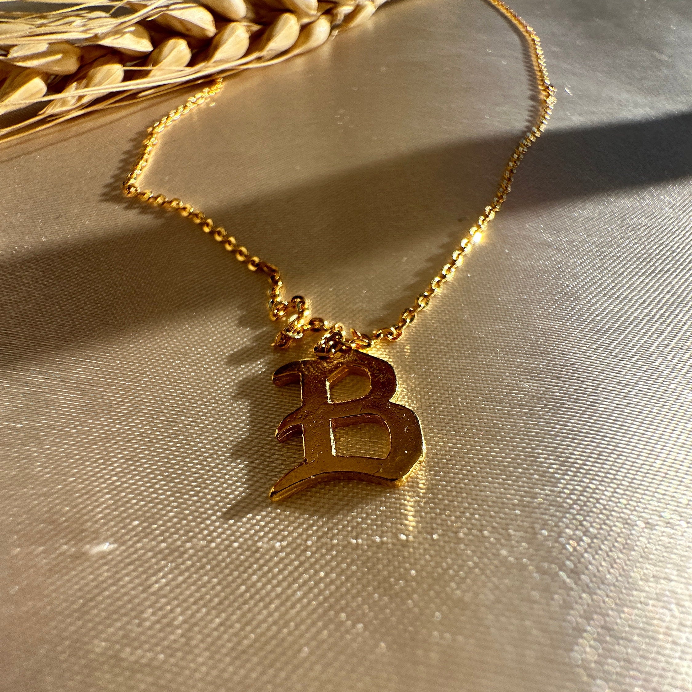 Gold chain deals with b pendant