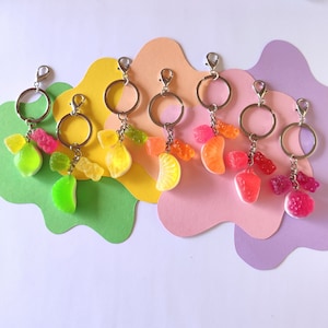 keychains with colorful gummy beras and other gummy candy charms made of epoxy resin