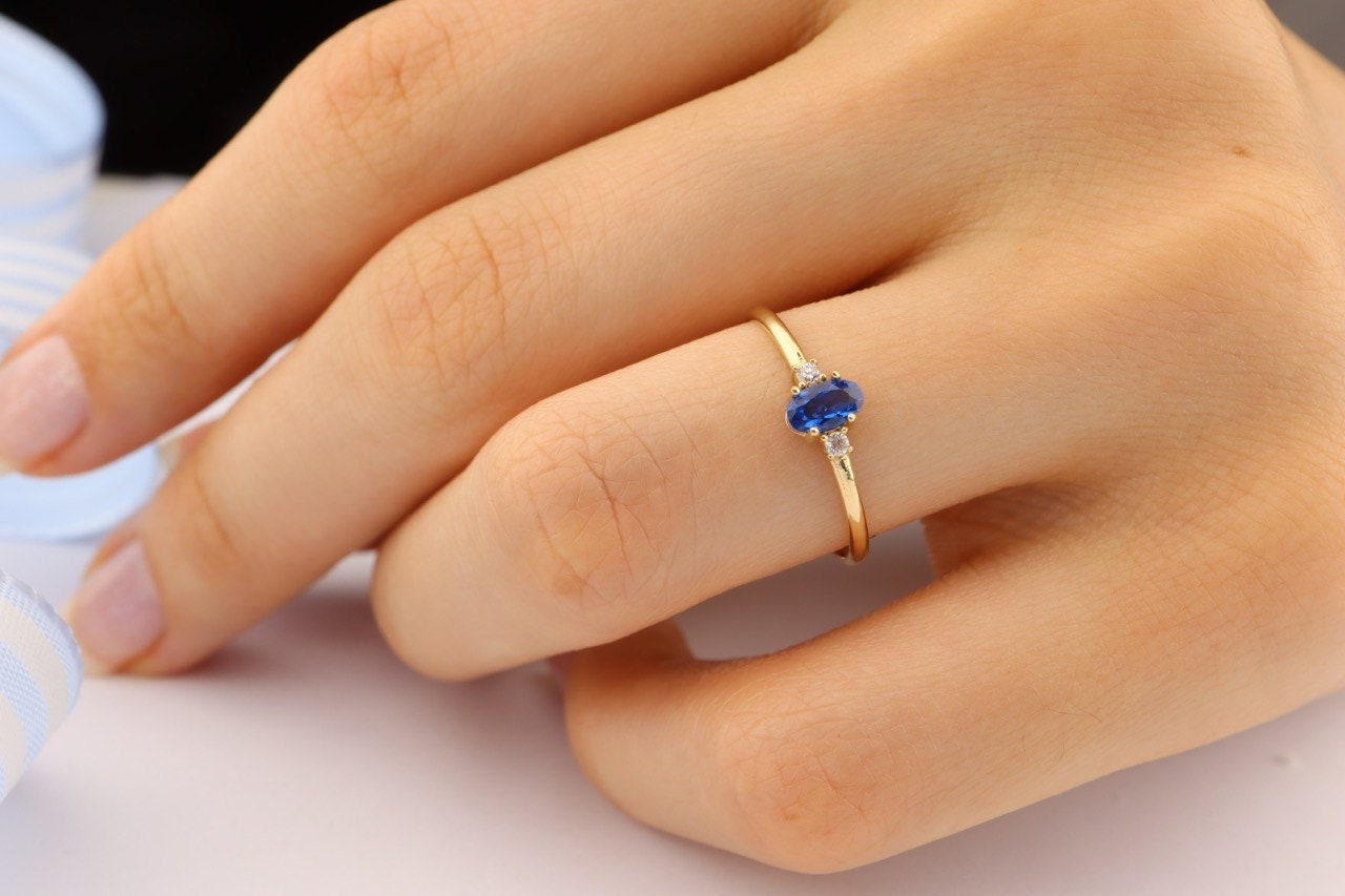 White gold ring shop with blue stone
