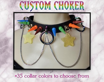 May include: A black choker necklace with colorful spikes and two star-shaped charms. The text "CUSTOM CHOKER" is at the top of the image. The text ".35 collar colors to choose from" is at the bottom of the image.