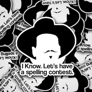May include: Black and white sticker with a cartoon cowboy wearing a hat and mustache. The sticker says "I Know. Let's have a spelling contest."