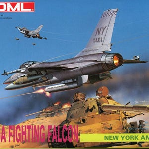 May include: A model kit of a grey F-16A Fighting Falcon fighter jet with the words "NY AF 401" on the tail. The jet is flying over a desert landscape with a tank in the foreground. The box art is from DML.
