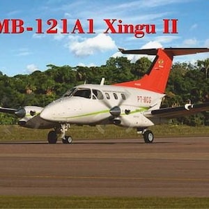 Può includere: Un kit di modellismo di un aereo EMB-121A1 Xingu II bianco con accenti rossi e verdi. L'aereo ha la registrazione PT-MCG sul lato. Il kit di modellismo è in scala 1:72.