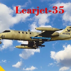 May include: A model of a Learjet-35 aircraft, painted in olive green, against a blue sky with clouds. The model has the number 41 on the nose and the text "Learjet-35" in red. The scale is 1:72.