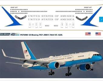 May include: A 1/144 scale model kit decal sheet for a Boeing 757-200 aircraft, featuring the livery of the United States Air Force, with the text "UNITED STATES OF AMERICA" and the registration number "80002".