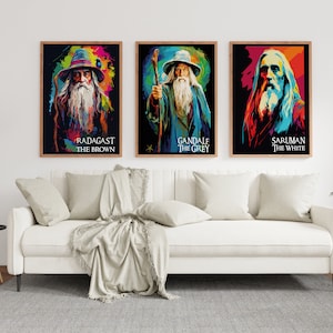 May include: Three colourful framed posters featuring portraits of wizards from The Lord of the Rings. The posters are titled "Radagast the Brown", "Gandalf the Grey", and "Saruman the White".