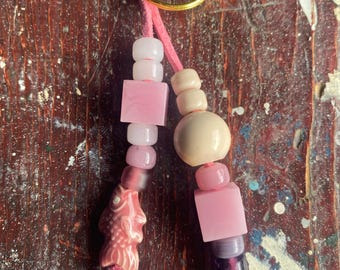 Faux leather beaded bag charm/vintage crow beads/resin beads/ceramic fish charm/gold clasp