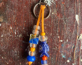 Faux leather beaded bag charm/vintage crow beads/resin beads/ceramic fish charm/silver clasp