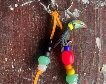 Faux leather beaded bag charm/vintage crow beads/resin beads/ceramic Toucan charm/gold clasp