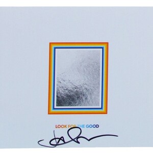 May include: A white CD case with a rainbow border around a silver image. The text "JASON MRZA LOOK FOR THE GOOD" is printed on the left side of the case. The text "LOOK FOR THE GOOD" is printed below the image. The case is signed with a black signature.