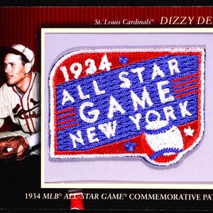 May include: A baseball card featuring a St. Louis Cardinals player and a commemorative patch. The patch is red, white, and blue, with "1934 ALL STAR GAME NEW YORK" text. The card also includes the text "1934 MLB ALL-STAR GAME COMMEMORATIVE PATCH".