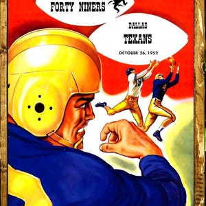 May include: Vintage football poster featuring a player in a yellow helmet and blue uniform. The poster advertises a game between the San Francisco Forty Niners and the Dallas Texans on October 26, 1952. The poster is framed in wood.