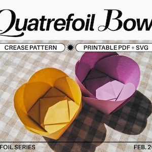 May include: Two origami bowls, one yellow and one purple, are folded into a quatrefoil shape. The bowls are sitting on a chequered tablecloth. The image includes the text "CREASE PATTERN", "PRINTABLE PDF + SVG", "01 FOIL SERIES", and "FEB. 2022".