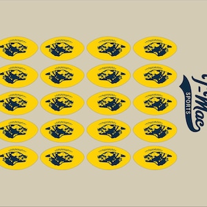 May include: A pattern of yellow footballs with a navy blue bear head design. The footballs are arranged in rows and columns on a beige background. The words "T-Mac SPORTS" are in navy blue on the right side.