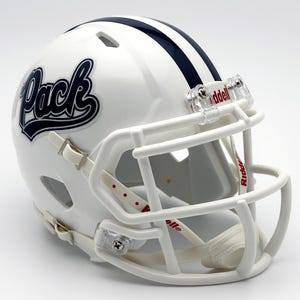 May include: A white football helmet with a navy blue stripe and the word "Pack" in navy script. The helmet has a white face mask and clear plastic clips. The Riddell logo is visible on the face mask.