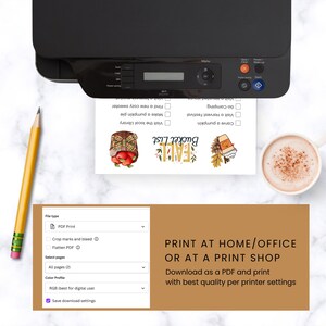 May include: A black printer sits atop a marble surface, printing a fall-themed bucket list. The list includes activities like carving pumpkins and visiting a harvest festival. A pencil and a cup of coffee are also visible.