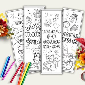 May include: Four black and white coloring bookmarks with autumn themes. The bookmarks feature text like "Happy Thanksgiving" and "Thankful for Friends." Images include leaves, pumpkins, and a squirrel holding an acorn. Colored pencils are in the foreground.