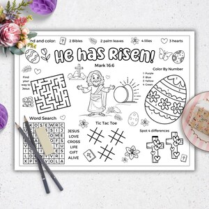 May include: A black and white printable Easter activity sheet with a word search, maze, tic-tac-toe game, color by number, and spot the difference game. The sheet features a picture of Jesus rising from the tomb and the text "He has risen! Mark 16:6".