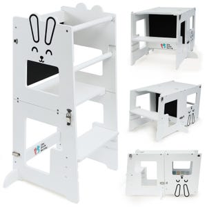 May include: White wooden learning tower with a bunny design. The tower has three shelves and a step stool. It can be converted into a table and chair set. The tower is designed for children to help them reach countertops and participate in activities with adults. The tower is made of high-quality wood and is safe for children.