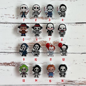 May include: A set of 16 horror movie character x-ray marker buttons. The buttons feature characters like Jason Voorhees, Freddy Krueger, Pennywise, and more. The buttons are numbered 1 through 16.