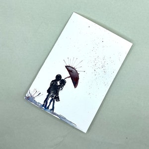 Amantes bajo la lluvia
