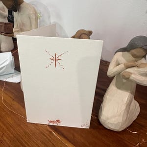 Bébé dans une crèche - Carte Nativité