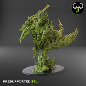 May include: A green, detailed, 3D printed miniature of a creature with wings, standing on a tree stump base. The creature is made of vines and leaves, and has a fierce expression.
