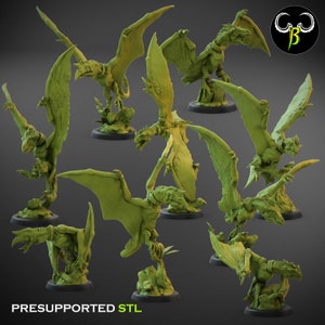 May include: A set of nine 3D printed miniature green dragon figures with wings outstretched. The figures are posed in various dynamic positions, with some perched on rocky bases. The text "PRESUPPORTED STL" is visible at the bottom of the image.