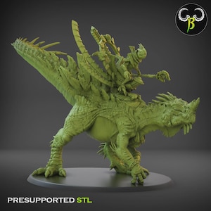 May include: A green 3D-printed model of a fantasy creature with a rider. The creature resembles a dinosaur with spiky protrusions along its back and tail. The rider is a humanoid figure holding a staff. The base reads "PRESUPPORTED STL".