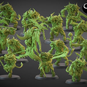 May include: A set of 12 green plastic miniature figures of horned, demonic creatures with various weapons and accessories. The figures are posed in dynamic stances and appear to be ready for battle.