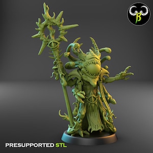 May include: A green, detailed 3D-printed figure of a fantasy creature with multiple eyes and tentacles. It holds a staff with a star-shaped top. The base reads "PRESUPPORTED STL".