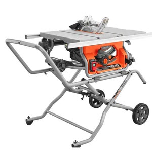 May include: An orange and grey table saw with a silver blade guard and a silver stand. The saw has a black blade and a red power button. The stand has wheels for easy movement. The brand name "RIDGID" is visible on the saw.