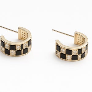 May include: A pair of gold hoop earrings with black and white checkerboard design. The earrings are made of metal and have a polished finish.