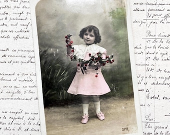 1900s - Postcard with a young girl and flowers
