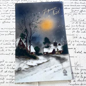 Lata 30. XX w. – pocztówka z zaśnieżonym krajobrazem i napisem „Joyeux Noël” / „Wesołych Świąt”