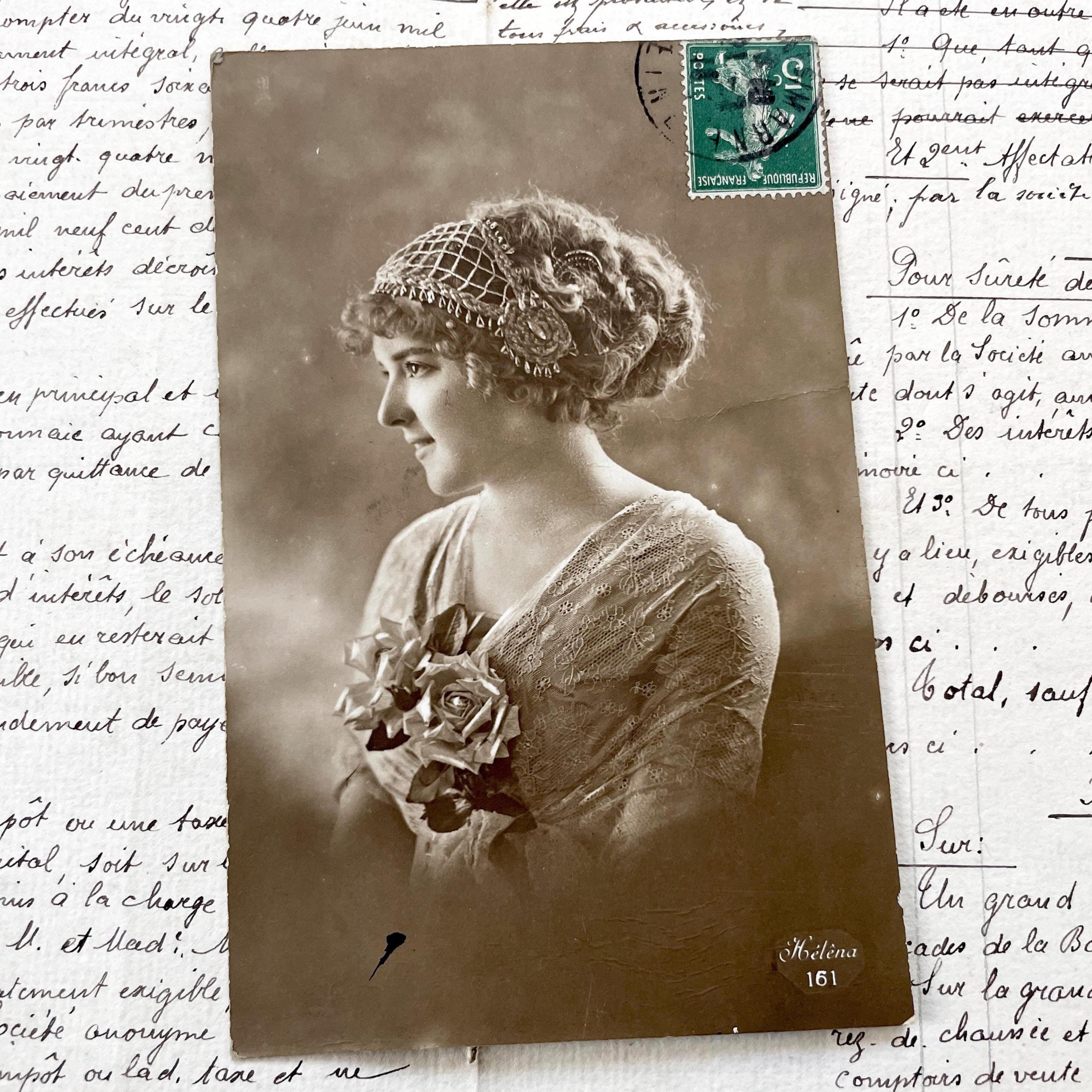 1910s - Postcard with a young woman and roses