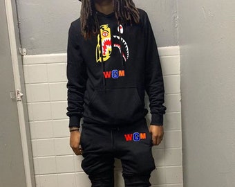 orange nike tech sweatsuit