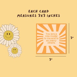 May include: A 3x3 inch card with an orange and white sunburst design. The card has the text "You are a role model to me and to so many others." printed in black.