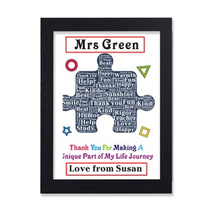 May include: A framed print with a blue puzzle piece design featuring the words "Mrs. Green" and "Thank You for Making a Unique Part of My Life Journey." The print also includes the words "Love from Susan."