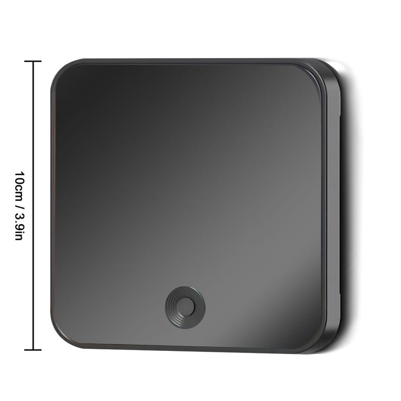 May include: A square, dark gray device with rounded corners, measuring 3.9 inches (10 cm) in height. It features a small, circular button at the bottom center. The device has a smooth, reflective surface.