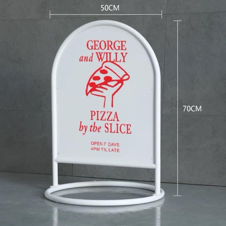 May include: White, arched-top sidewalk sign, 50cm wide and 70cm tall, with a circular base. The sign features red text and a pizza slice graphic. Text reads "GEORGE and WILLY PIZZA by the SLICE" and "OPEN 7 DAYS 4PM TIL LATE".