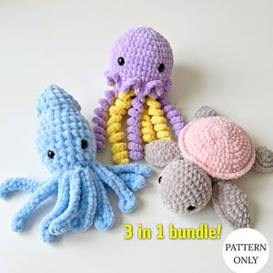 May include: Three crocheted plush toys including a light blue squid, a purple and yellow jellyfish, and a pink and gray turtle. The text 3 in 1 bundle! PATTERN ONLY is displayed in yellow and black at the bottom of the image.