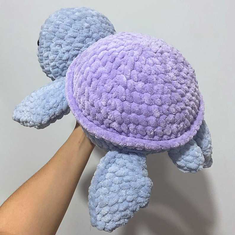 A cute stuffed animal plushie. It is a jumbo turtle, in blue and lilac. This listing offers a detailed PDF crochet pattern to make this adorable amigurumi. Easy, beginner friendly tutorial with guide photos and instructions.