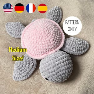 A turtle crochet plushie made with soft yarn, made with colours pink and grey. This is a medium sized turtle. This listing is a crochet pattern PDF tutorial.