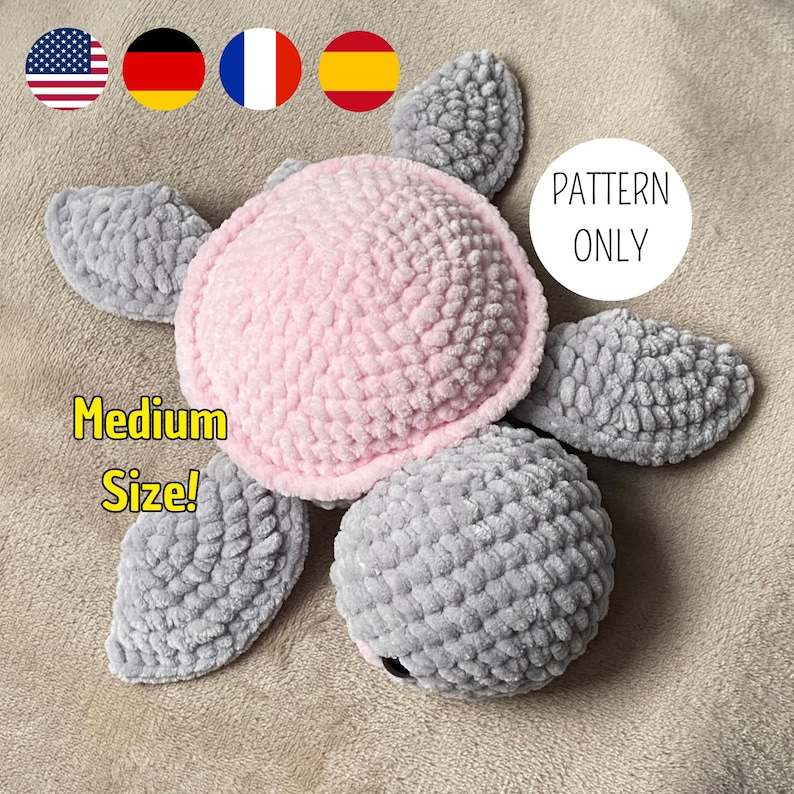 A turtle crochet plushie made with soft yarn, made with colours pink and grey. This is a medium sized turtle. This listing is a crochet pattern PDF tutorial.