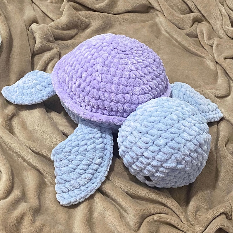 A cute stuffed animal plushie. It is a jumbo turtle, in blue and lilac. This listing offers a detailed PDF crochet pattern to make this adorable amigurumi. Easy, beginner friendly tutorial with guide photos and instructions.