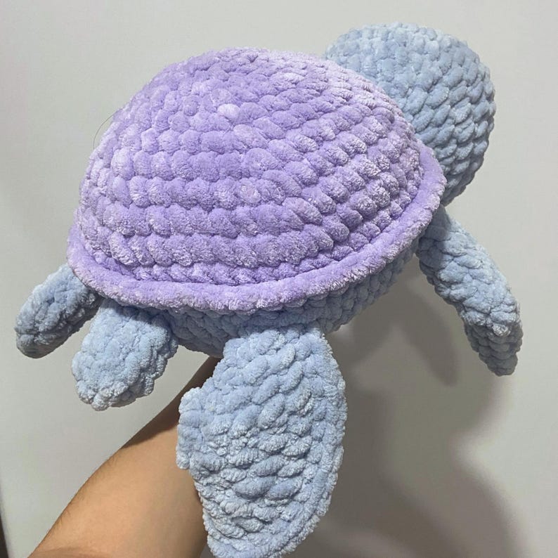 A cute stuffed animal plushie. It is a jumbo turtle, in blue and lilac. This listing offers a detailed PDF crochet pattern to make this adorable amigurumi. Easy, beginner friendly tutorial with guide photos and instructions.