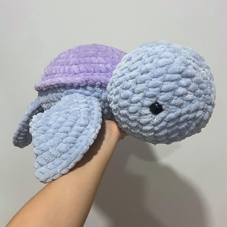A cute stuffed animal plushie. It is a jumbo turtle, in blue and lilac. This listing offers a detailed PDF crochet pattern to make this adorable amigurumi. Easy, beginner friendly tutorial with guide photos and instructions.