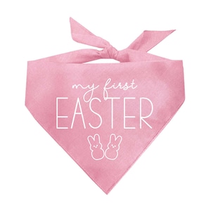 May include: Pink fabric bandana with white text that reads "my first easter" and two white bunny silhouettes.