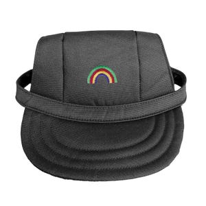 May include: A black cap with a curved brim and a strap. The cap features a small, embroidered rainbow in red, yellow, green, and blue. The cap is made of a textured fabric.